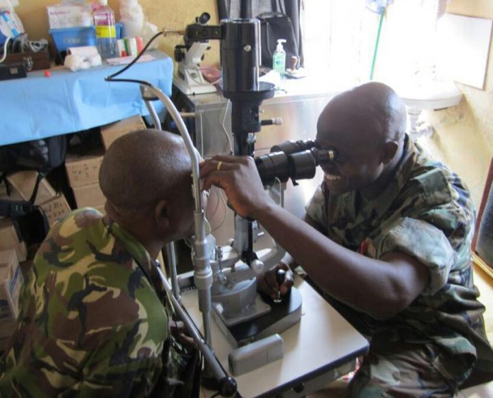 Ophthalmology Nurse Fayiah Momorie trains with a new slit lamp in Military Hospital 34, Freetown, Sierra Leone. Image/University of Liverpool