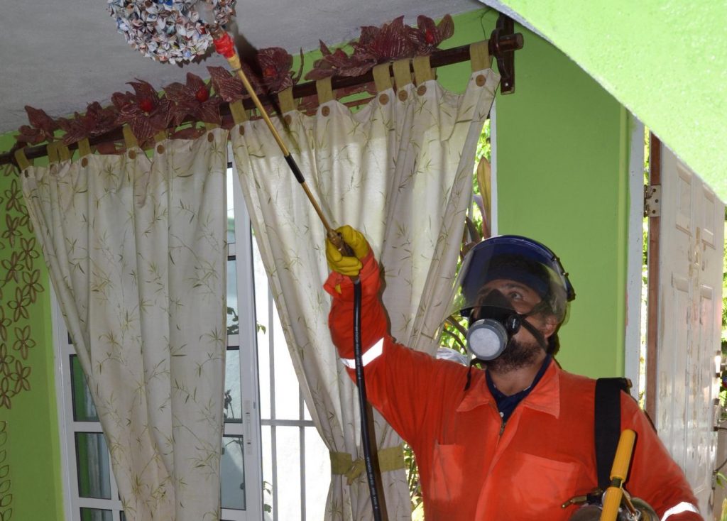 A research technician sprays the ceiling and walls of a home in Merida, Mexico, as part of the first study to show how vital insecticide-resistance monitoring is to control a mosquito that can spread the Zika virus. Image/Nsa Dada